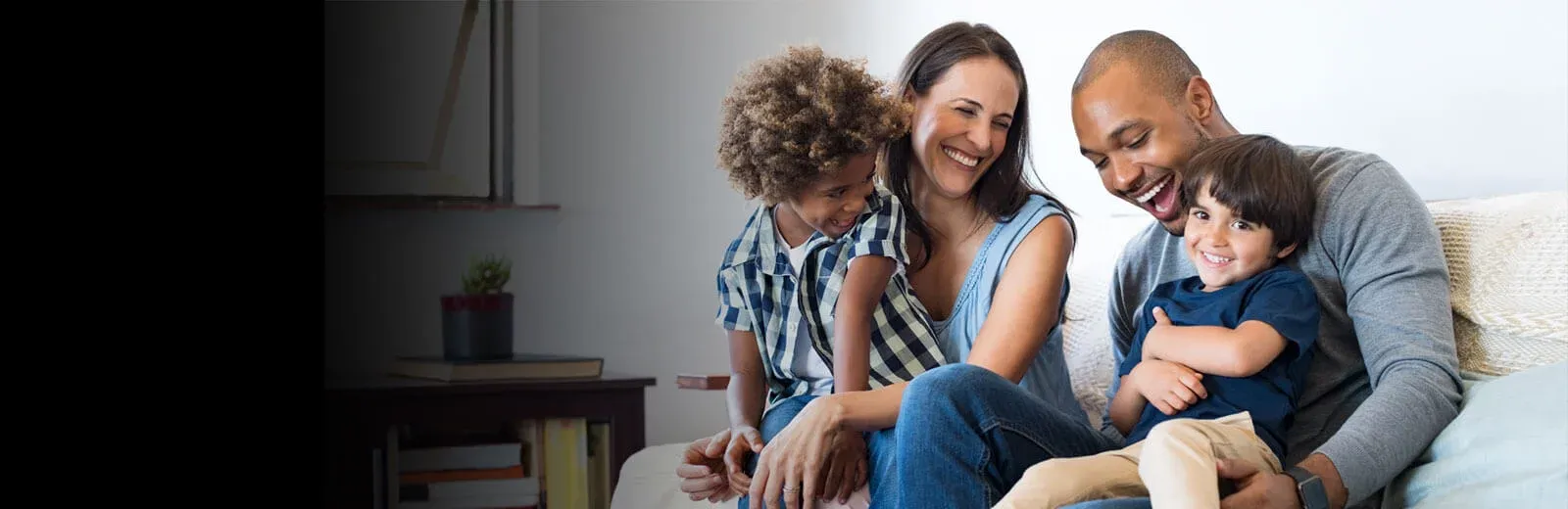 Family laughing and playing in pest free living room