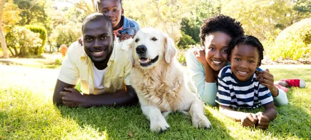 Family outside with dog